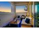 Relaxing balcony with cozy seating, a modern fire pit, and beautiful sunset views at 2700 Las Vegas Blvd # 1401, Las Vegas, NV 89109
