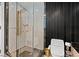 Modern bathroom with marble shower, toilet and black and gold decor at 2700 Las Vegas Blvd # 1401, Las Vegas, NV 89109