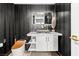 Modern bathroom featuring a toilet with a bronze seat, designer tile, and a unique marble sink at 2700 Las Vegas Blvd # 1401, Las Vegas, NV 89109