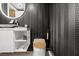 Sleek bathroom features a modern sink, toilet and designer wallpaper accents at 2700 Las Vegas Blvd # 1401, Las Vegas, NV 89109