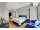 Modern bedroom with hardwood floors, luxury couch and sleek dark furniture at 2700 Las Vegas Blvd # 1401, Las Vegas, NV 89109