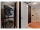 Convenient stacked washer and dryer in a brightly lit laundry room at 2700 Las Vegas Blvd # 1401, Las Vegas, NV 89109