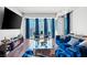 A contemporary living room has hardwood floors and floor to ceiling windows at 2700 Las Vegas Blvd # 1401, Las Vegas, NV 89109