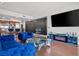 Inviting living room featuring blue velvet furniture, open layout, and hardwood flooring at 2700 Las Vegas Blvd # 1401, Las Vegas, NV 89109