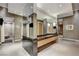 Modern locker room with mosaic tiling, a vanity area, and convenient shower access at 2700 Las Vegas Blvd # 1401, Las Vegas, NV 89109