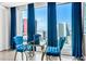 Chic sitting area with blue velvet chairs and a lovely view of the Las Vegas skyline at 2700 Las Vegas Blvd # 1401, Las Vegas, NV 89109