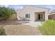 Rear exterior showcasing a cozy patio and xeriscape landscaping at 2839 Strathallan Ave, Henderson, NV 89044