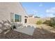 Rear exterior showcasing a cozy patio and xeriscape landscaping at 2839 Strathallan Ave, Henderson, NV 89044