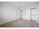 Neutral bedroom offers ceiling fan and closet with sliding doors at 2839 Strathallan Ave, Henderson, NV 89044