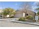 Inviting single-Gathering home with desert landscaping, a two-car garage, and a neutral-toned exterior at 2839 Strathallan Ave, Henderson, NV 89044