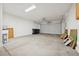 Spacious garage with high ceilings, a large door, and ample room for storage and parking at 2839 Strathallan Ave, Henderson, NV 89044