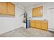 Clean garage area with storage cabinets, water heater, and utility connections at 2839 Strathallan Ave, Henderson, NV 89044