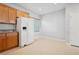 Bright eat-in kitchen featuring white appliances, neutral flooring and plenty of natural light at 2839 Strathallan Ave, Henderson, NV 89044