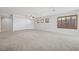 Bright living room features neutral paint, carpet, and modern ceiling fan at 2839 Strathallan Ave, Henderson, NV 89044