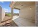 Exterior view of the covered patio with a desert-landscaped backyard at 2839 Strathallan Ave, Henderson, NV 89044