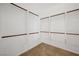 A well organized walk-in closet with built in shelves and rods at 2839 Strathallan Ave, Henderson, NV 89044