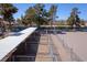Overhead view of outdoor horse stalls with metal roofing adjacent to a riding ring at 2900 Thurman Ave, Las Vegas, NV 89120