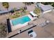 Aerial shot showcasing the sparkling pool, diving board, and covered patio of this private backyard at 2900 Thurman Ave, Las Vegas, NV 89120