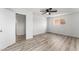 Bedroom with wood-look flooring, ceiling fan, and large doorway at 2915 Cedar Ave # 12C, Las Vegas, NV 89101