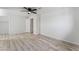 Bright bedroom features modern ceiling fan and light wood-look flooring at 2915 Cedar Ave # 12C, Las Vegas, NV 89101