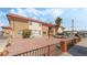 Exterior of multi-Gathering home with a red roof, desert landscaping, and ample parking at 2915 Cedar Ave # 12C, Las Vegas, NV 89101