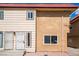 Charming exterior view of the apartment building featuring two-tone paint and desert landscaping at 2915 Cedar Ave # 12C, Las Vegas, NV 89101