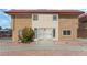 Front exterior of a multi-Gathering home with desert landscaping and a red-tiled roof at 2915 Cedar Ave # 12C, Las Vegas, NV 89101