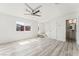 Well-lit living room featuring light grey floors, white walls, and abundant natural light at 2915 Cedar Ave # 12C, Las Vegas, NV 89101