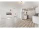 Open concept living room featuring ample natural light, a ceiling fan, and wood-look floors at 2915 Cedar Ave # 12C, Las Vegas, NV 89101