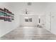 Bright and open living room with gray-tone wood flooring and a ceiling fan at 2915 Cedar Ave # 12C, Las Vegas, NV 89101