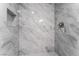 Updated shower with gray marble-look tiling and recessed niche at 2915 Cedar Ave # 12C, Las Vegas, NV 89101