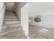 Staircase with modern gray wood floors leading to the upper level of the home at 2915 Cedar Ave # 12C, Las Vegas, NV 89101
