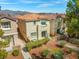 An aerial view of the townhouse showcasing landscaping, a private patio, and the red tile roof at 3023 Sunrise Bay Ave, North Las Vegas, NV 89031
