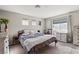 Comfortable bedroom with neutral tones, carpet floors, and ample natural light at 3023 Sunrise Bay Ave, North Las Vegas, NV 89031