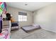 bedroom with playful decor, ample natural light, and carpet flooring at 3023 Sunrise Bay Ave, North Las Vegas, NV 89031