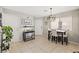 Inviting dining area with tile flooring, a stylish table set, and a decorative 'home' sign at 3023 Sunrise Bay Ave, North Las Vegas, NV 89031