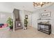 Open entryway featuring tile flooring, staircase with baby gate, and a charming 'home' decor piece at 3023 Sunrise Bay Ave, North Las Vegas, NV 89031
