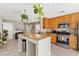Well-lit kitchen featuring stainless steel appliances, granite countertops, and ample cabinet storage at 3023 Sunrise Bay Ave, North Las Vegas, NV 89031