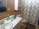 This bathroom has a sink, toilet, shower and printed shower curtain at 3127 Aloha Ave, Las Vegas, NV 89121