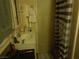 This is a bathroom featuring a sink, mirror, shower and other essentials at 3127 Aloha Ave, Las Vegas, NV 89121