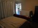 This bedroom has a view into another room with neutral walls and carpeting at 3127 Aloha Ave, Las Vegas, NV 89121