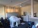 This bedroom offers a spacious layout with natural light, neutral walls and a ceiling fan at 3127 Aloha Ave, Las Vegas, NV 89121