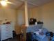 This bedroom has light colored walls, a dividing pillar and neutral carpeting at 3127 Aloha Ave, Las Vegas, NV 89121