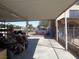 Carport featuring ample covered parking, storage shelves, and views of the street and adjacent properties at 3127 Aloha Ave, Las Vegas, NV 89121