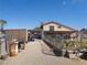 Home exterior featuring a covered driveway, mature landscaping, and a view of the upper level windows at 3127 Aloha Ave, Las Vegas, NV 89121