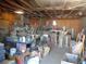 Spacious garage interior featuring exposed wooden beams and ample storage space, perfect for a workshop or hobby area at 3127 Aloha Ave, Las Vegas, NV 89121