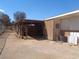 This exterior shows an open horse barn with a dirt ground area and metal gated fencing at 3127 Aloha Ave, Las Vegas, NV 89121