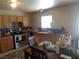 Functional kitchen showcasing wooden cabinets, granite countertops, and modern appliances at 3127 Aloha Ave, Las Vegas, NV 89121