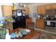 A functional kitchen includes wooden cabinets, granite countertops, and stainless steel appliances at 3127 Aloha Ave, Las Vegas, NV 89121