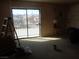 This living room has natural light, neutral walls and a sliding glass door at 3127 Aloha Ave, Las Vegas, NV 89121